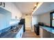 Modern kitchen with sleek countertops, stainless steel sink and appliances, and ample cabinet space at 170 Copper St, Henderson, NV 89015