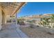 Backyard featuring decorative landscaping and covered awning at 2167 Shadow Canyon Dr, Henderson, NV 89044
