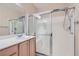 Well-lit bathroom featuring a single vanity sink and glass-enclosed shower at 2167 Shadow Canyon Dr, Henderson, NV 89044