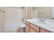Bathroom with tiled floors, vanity and sink, and tub with shower at 2167 Shadow Canyon Dr, Henderson, NV 89044