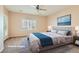This staged bedroom offers a ceiling fan, shuttered window, and stylish accents at 2167 Shadow Canyon Dr, Henderson, NV 89044
