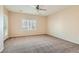 Comfortable bedroom featuring neutral colors, plush carpeting, and plantation shutters at 2167 Shadow Canyon Dr, Henderson, NV 89044
