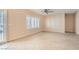 Large bedroom with neutral carpeting, ceiling fan, natural light, and plantation shutters at 2167 Shadow Canyon Dr, Henderson, NV 89044