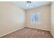 Bright bedroom with neutral colors, plush carpeting, and a window with plantation shutters at 2167 Shadow Canyon Dr, Henderson, NV 89044