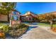 A clubhouse with walking paths, desert landscaping and a sign for fitness and activities at 2167 Shadow Canyon Dr, Henderson, NV 89044