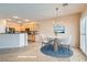 Bright dining area adjacent to kitchen featuring a chandelier and sliding glass doors at 2167 Shadow Canyon Dr, Henderson, NV 89044