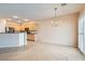 Bright dining area with tile flooring, chandelier, and view of open kitchen at 2167 Shadow Canyon Dr, Henderson, NV 89044
