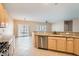 Open kitchen with granite countertops and stainless steel appliances view to dining and living spaces at 2167 Shadow Canyon Dr, Henderson, NV 89044