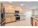Bright kitchen featuring stainless steel appliances and light wood cabinets at 2167 Shadow Canyon Dr, Henderson, NV 89044