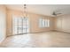 Spacious living room featuring tile flooring, plantation shutters and modern ceiling fan at 2167 Shadow Canyon Dr, Henderson, NV 89044
