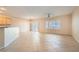 Bright living room featuring tile flooring, plantation shutters and contemporary lighting fixture at 2167 Shadow Canyon Dr, Henderson, NV 89044