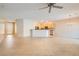 Open-concept home with tile floors flowing through the living room, dining, and kitchen areas at 2167 Shadow Canyon Dr, Henderson, NV 89044
