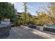 Beautifully landscaped backyard with a built-in BBQ, inviting fire pit, and sparkling spa at 2215 Alcova Ridge Dr, Las Vegas, NV 89135