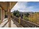 This balcony features views of palm trees, nearby rooftops, and bright blue sky at 2215 Alcova Ridge Dr, Las Vegas, NV 89135