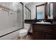 Elegant bathroom with a shower over the tub and a stylish vanity at 2215 Alcova Ridge Dr, Las Vegas, NV 89135
