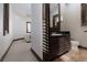 Convenient bathroom with dark wood vanity, granite countertop, and classic fixtures at 2215 Alcova Ridge Dr, Las Vegas, NV 89135