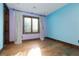 Bright bedroom with beautiful hard wood floors and custom trim with a large window at 2215 Alcova Ridge Dr, Las Vegas, NV 89135