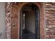 Close-up of an open arched entryway with brick detail, leading to the home's interior at 2215 Alcova Ridge Dr, Las Vegas, NV 89135