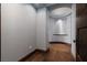 View of hallway and adjoining room with designer architectural details and wood flooring at 2215 Alcova Ridge Dr, Las Vegas, NV 89135