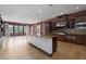 Kitchen with granite island, stainless appliances, hardwood flooring and windows with natural light at 2215 Alcova Ridge Dr, Las Vegas, NV 89135