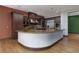 Gourmet kitchen with custom cabinetry, granite countertops, stainless steel appliances, and breakfast bar at 2215 Alcova Ridge Dr, Las Vegas, NV 89135