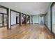 Large living room with wood floors, columns, and French doors to outside at 2215 Alcova Ridge Dr, Las Vegas, NV 89135