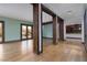 Expansive living room with hardwood floors, natural light, and seamless flow to outdoor patio area at 2215 Alcova Ridge Dr, Las Vegas, NV 89135