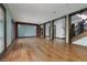 Expansive open-concept room with wood floors, multiple entryways, and ample natural light at 2215 Alcova Ridge Dr, Las Vegas, NV 89135