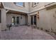 Charming patio area with stamped concrete flooring and access to the home through glass doors at 2215 Alcova Ridge Dr, Las Vegas, NV 89135
