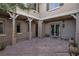 Charming covered patio area with stone flooring, perfect for outdoor entertaining and relaxation at 2215 Alcova Ridge Dr, Las Vegas, NV 89135