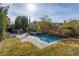 Inviting swimming pool and spa surrounded by lush landscaping, offering a serene retreat at 2215 Alcova Ridge Dr, Las Vegas, NV 89135