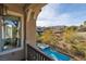 Balcony view of a serene backyard featuring a private pool and lush landscaping, creating a tranquil retreat at 2215 Alcova Ridge Dr, Las Vegas, NV 89135