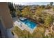 Backyard view from balcony showcases a refreshing pool, spa and an inviting entertaining area at 2215 Alcova Ridge Dr, Las Vegas, NV 89135
