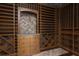Custom wine cellar with extensive shelving, tiled backsplash, and built-in drawers at 2215 Alcova Ridge Dr, Las Vegas, NV 89135