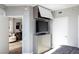 Modern bedroom with entertainment center, TV and views into adjacent sitting room at 222 Karen Ave # 3104, Las Vegas, NV 89109