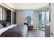 Modern bedroom features a large window with city views, built-in storage, and sleek furnishings at 222 Karen Ave # 3104, Las Vegas, NV 89109