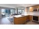 Modern kitchen with breakfast bar, stainless appliances, and access to a bright, stylish living area at 222 Karen Ave # 3104, Las Vegas, NV 89109