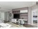 Open-concept living space with breakfast bar, built-in storage, and a adjacent desk for working from home at 222 Karen Ave # 3104, Las Vegas, NV 89109