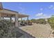 Wonderful backyard view of the covered patio and desert landscaping at 2256 Cordaville Dr, Henderson, NV 89044