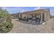 Wide backyard with rockscape and covered patio at 2256 Cordaville Dr, Henderson, NV 89044