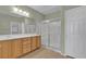 Spacious bathroom with double sink vanity, framed mirror, and glass-enclosed shower stall at 2256 Cordaville Dr, Henderson, NV 89044