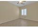 Bedroom offers large window with shutters, neutral paint, tile flooring and ceiling fan at 2256 Cordaville Dr, Henderson, NV 89044
