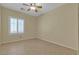 Inviting bedroom features tile floors, large window with shutters and a ceiling fan at 2256 Cordaville Dr, Henderson, NV 89044