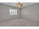 Bedroom showcasing plantation shutters, neutral carpet, and ceiling fan, offering a peaceful retreat at 2256 Cordaville Dr, Henderson, NV 89044