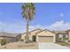 Charming single-story home with a well-maintained yard and a tall palm tree on a sunny day at 2256 Cordaville Dr, Henderson, NV 89044