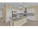 Modern kitchen featuring an island, stainless appliances, and white cabinetry at 2256 Cordaville Dr, Henderson, NV 89044