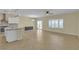 Open concept living room and kitchen area with tile floors and sliding glass door access at 2256 Cordaville Dr, Henderson, NV 89044