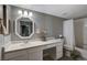 Bathroom with a large vanity, octagonal mirror, and a shower-tub combination at 2300 E Silverado Ranch Blvd # 1123, Las Vegas, NV 89183