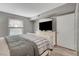 Bedroom with a large window, television, and wood-look floors at 2300 E Silverado Ranch Blvd # 1123, Las Vegas, NV 89183