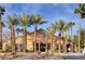 Latigo at Silverado Ranch clubhouse surrounded by meticulously maintained grounds and majestic palm trees at 2300 E Silverado Ranch Blvd # 1123, Las Vegas, NV 89183